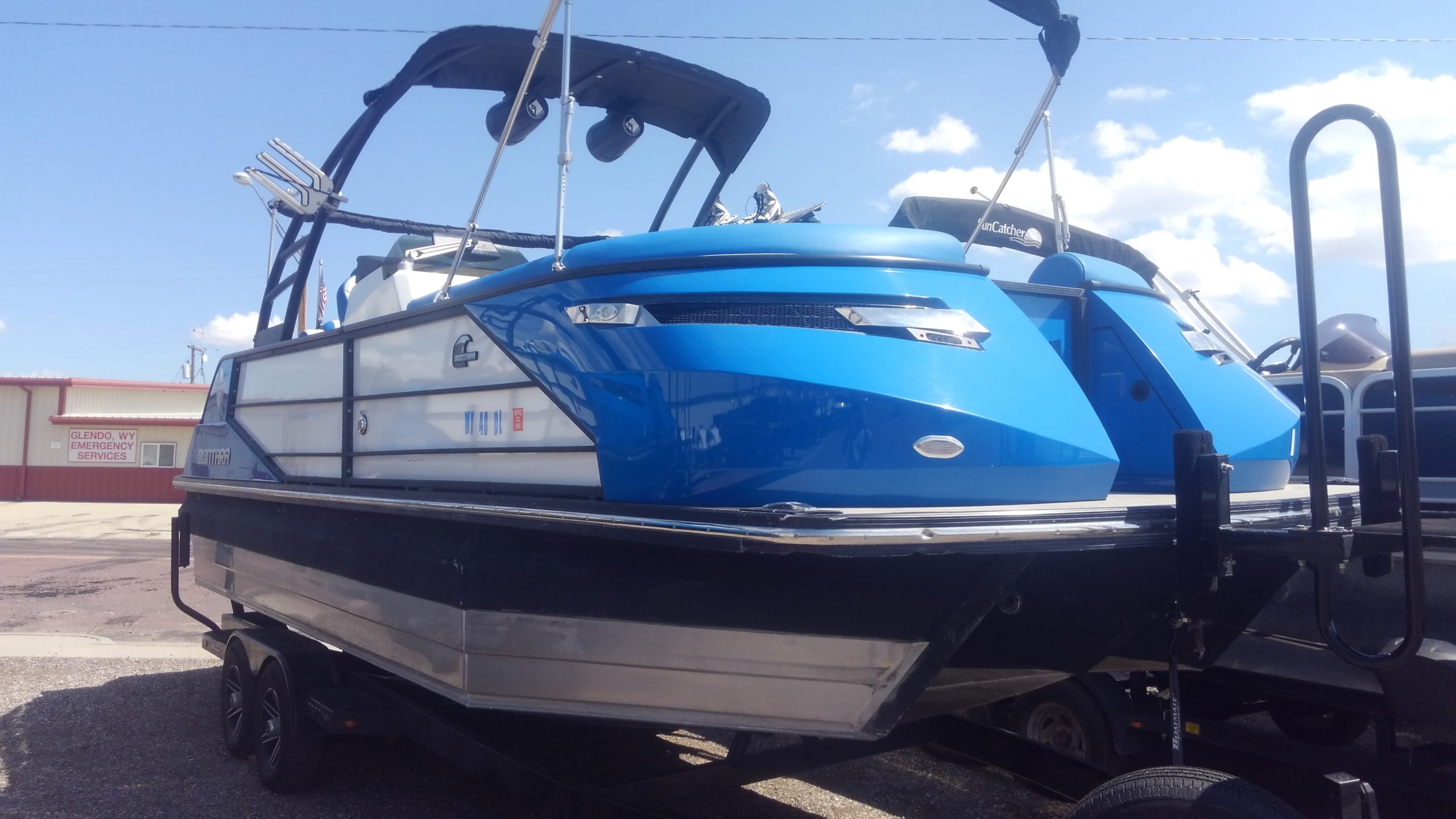 a boat that is sitting on a blue surface